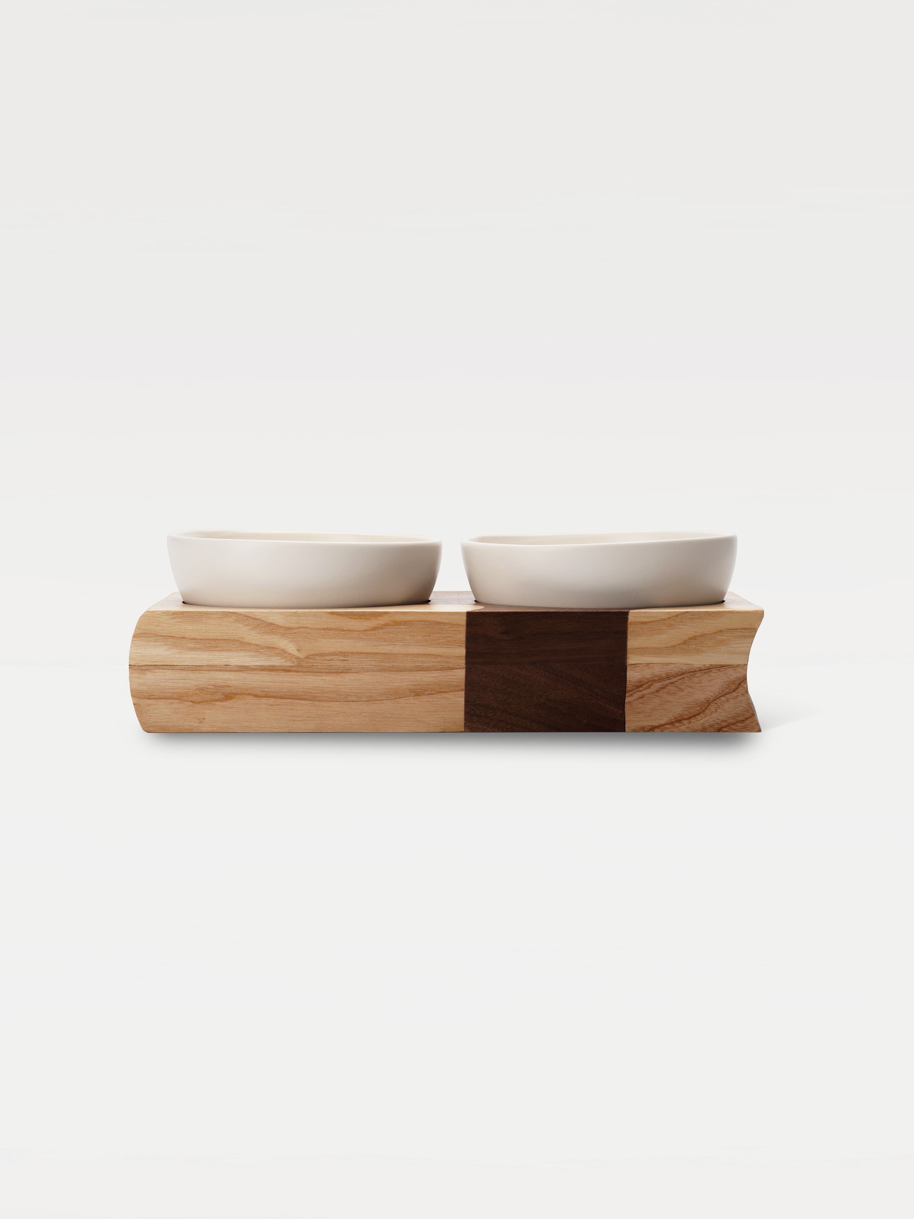 Two bowls on a wooden two tone tray