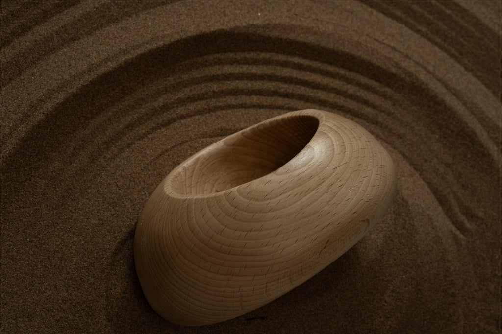 A pebble-shaped wooden bowl base